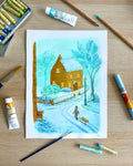 Winter scene painting on a wooden surface with art supplies